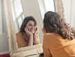 Photo by Andrea Piacquadio: photo of woman looking at the mirror